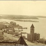 Black-and-white photograph, view of Rat Portage and water, c. 1900.